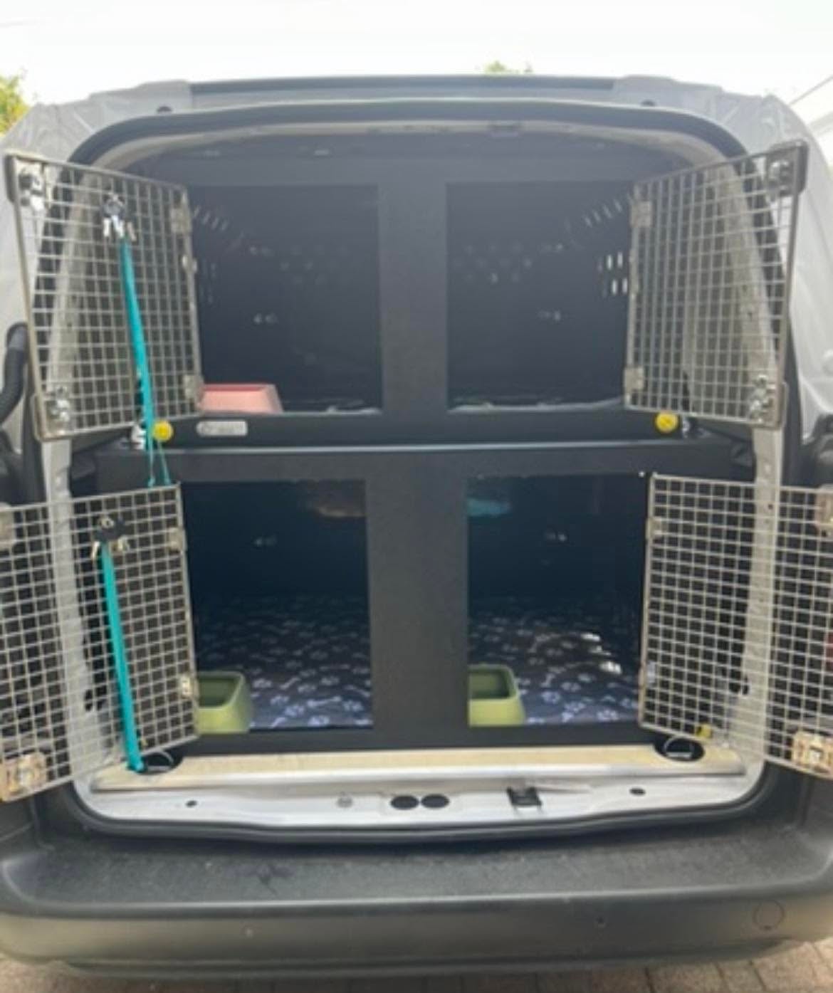 Goofy Paws van interior showing secure dog transport crates